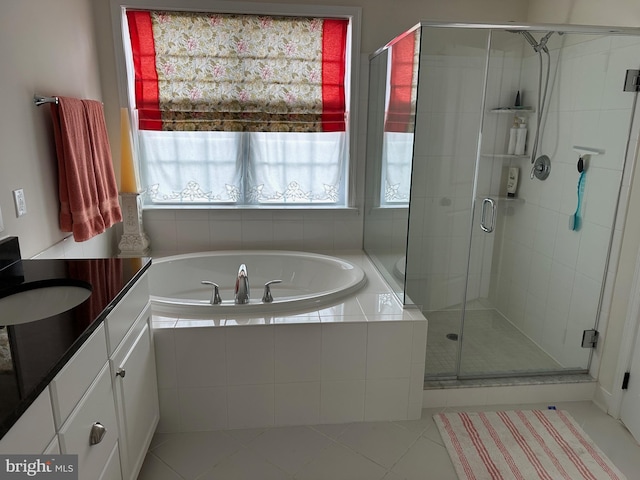 8537 Pine Springs Dr, Severn, MD 21144 - full bathroom featuring a stall shower, tile patterned floors, vanity, and a bath
