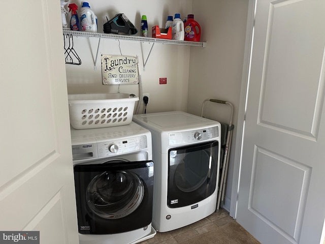 8537 Pine Springs Dr, Severn, MD 21144 - washroom featuring laundry area, stone finish flooring, and separate washer and dryer
