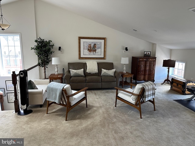 8537 Pine Springs Dr, Severn, MD 21144 - living room with light carpet, high vaulted ceiling, and visible vents