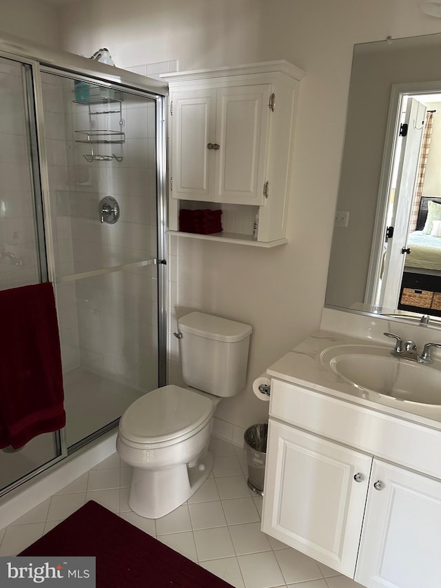 8537 Pine Springs Dr, Severn, MD 21144 - ensuite bathroom featuring vanity, toilet, tile patterned floors, and a shower stall