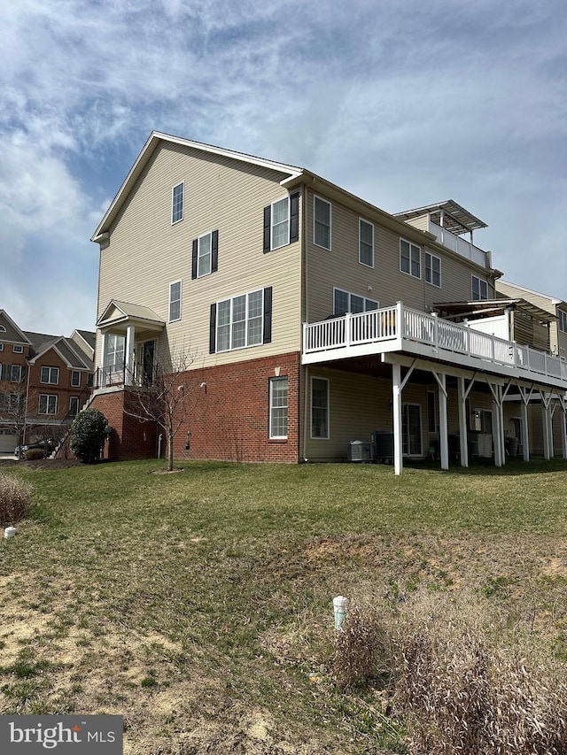 8537 Pine Springs Dr, Severn, MD 21144 - back of house featuring brick siding, cooling unit, and a yard