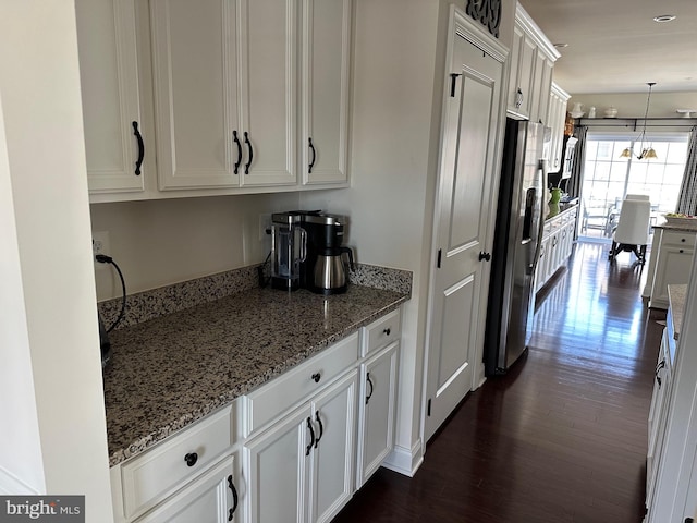 8537 Pine Springs Dr, Severn, MD 21144 - kitchen with dark wood finished floors, stainless steel fridge with ice dispenser, white cabinetry, and stone counters