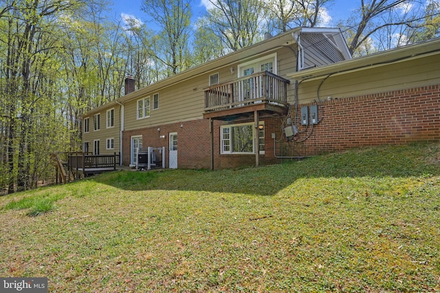 7058 Crespo Ln, Manassas, VA 20112 - back of property featuring brick siding, a chimney, a deck, and a lawn