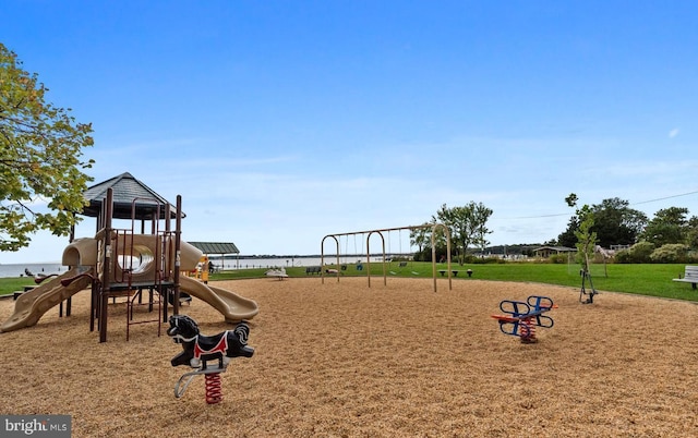 community jungle gym featuring a lawn