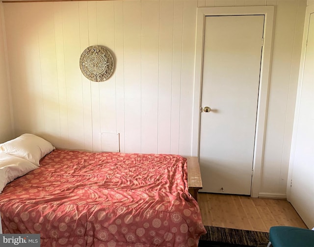 bedroom featuring wood finished floors