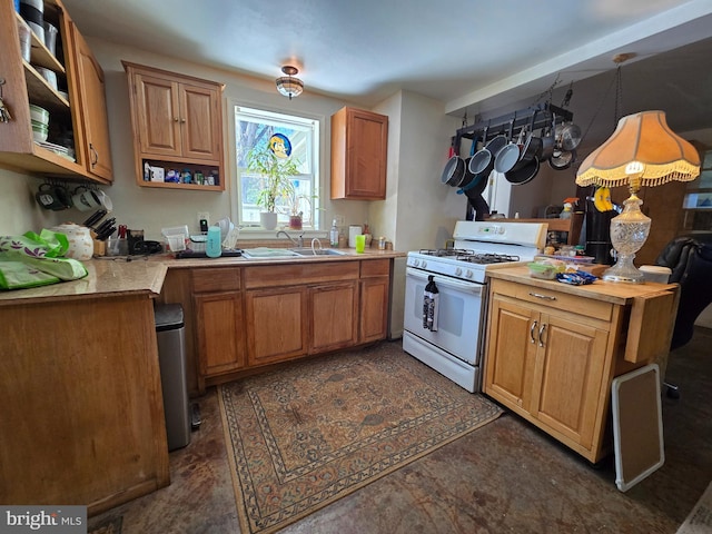 kitchen with light countertops, open shelves, white gas range, a sink, and brown cabinetry