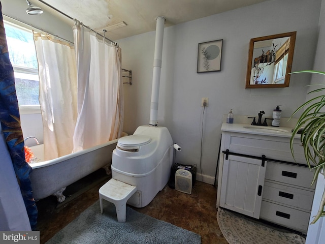 bathroom featuring toilet, concrete flooring, shower / tub combo with curtain, and vanity