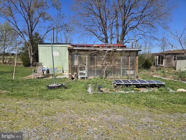 view of outdoor structure featuring an outdoor structure and solar panels