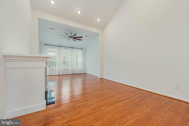 19062 Timbercreek Dr Unit 46, Milton, DE 19968 - unfurnished living room with high vaulted ceiling, light wood finished floors, baseboards, ceiling fan, and recessed lighting