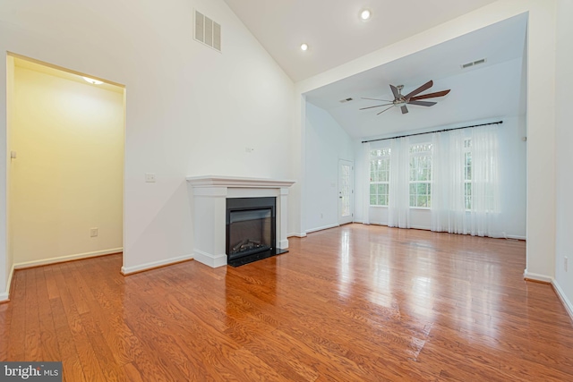19062 Timbercreek Dr Unit 46, Milton, DE 19968 - unfurnished living room with a fireplace, ceiling fan, visible vents, and wood finished floors