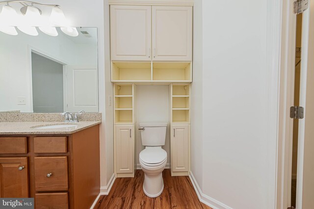 19062 Timbercreek Dr Unit 46, Milton, DE 19968 - bathroom featuring toilet, vanity, and wood finished floors