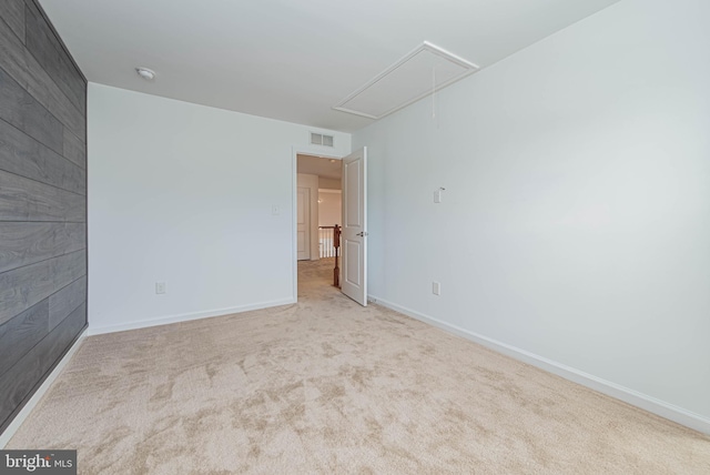 19062 Timbercreek Dr Unit 46, Milton, DE 19968 - carpeted empty room with baseboards, visible vents, wooden walls, and attic access