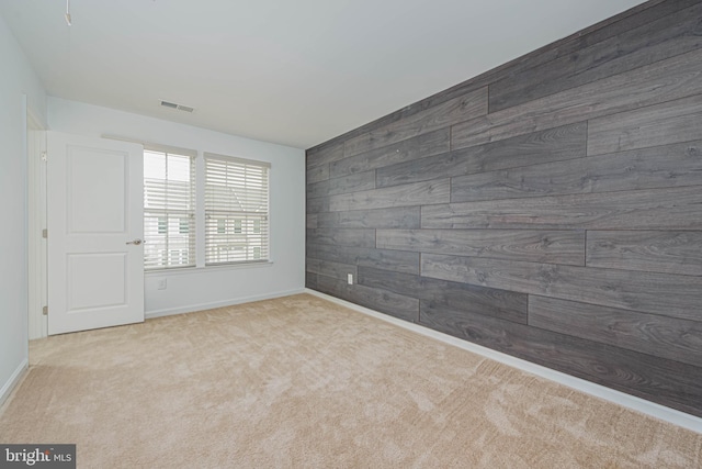 19062 Timbercreek Dr Unit 46, Milton, DE 19968 - spare room with visible vents, wooden walls, and carpet