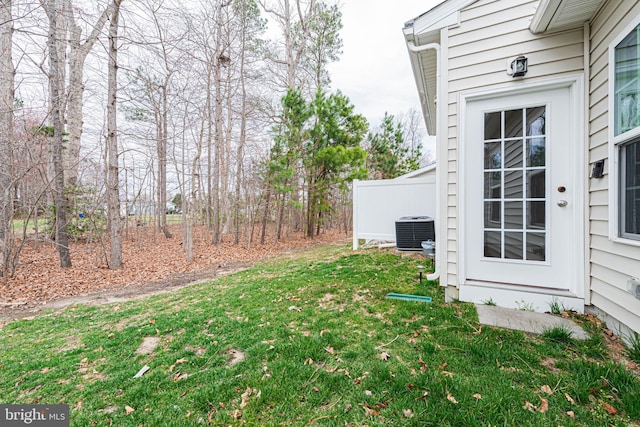 19062 Timbercreek Dr Unit 46, Milton, DE 19968 - view of yard featuring central AC and fence