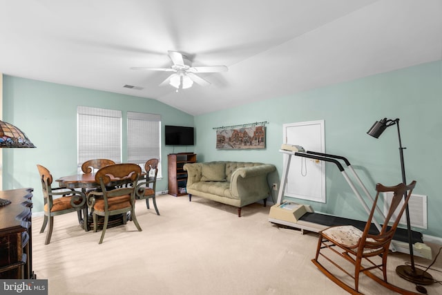 interior space featuring carpet flooring, visible vents, vaulted ceiling, and ceiling fan