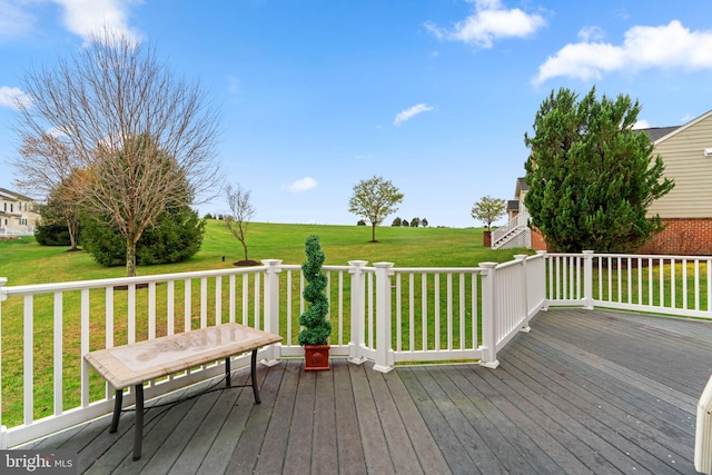 wooden deck featuring a yard