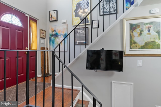 entrance foyer with stairway and wood finished floors