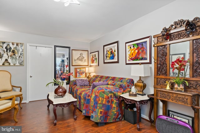 bedroom with wood finished floors and baseboards