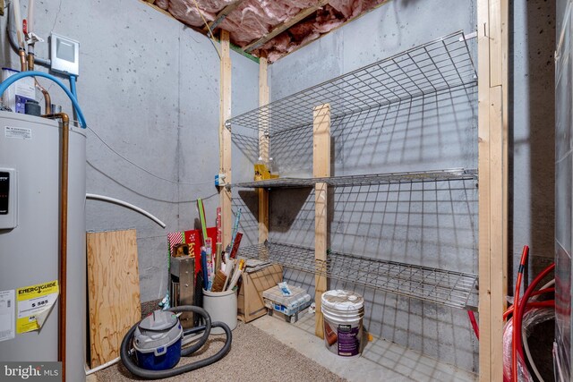storage room featuring water heater