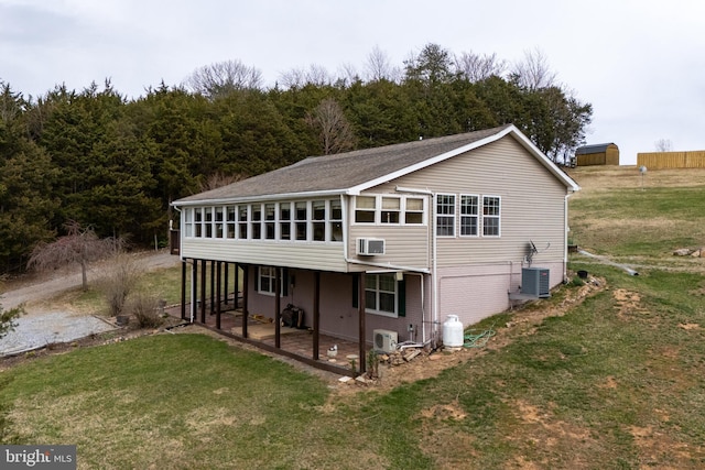 exterior space with cooling unit and a sunroom