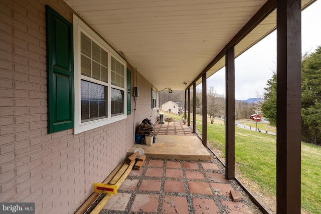 view of patio / terrace featuring covered porch and a mountain view
