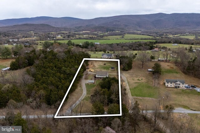 drone / aerial view featuring a mountain view and a rural view