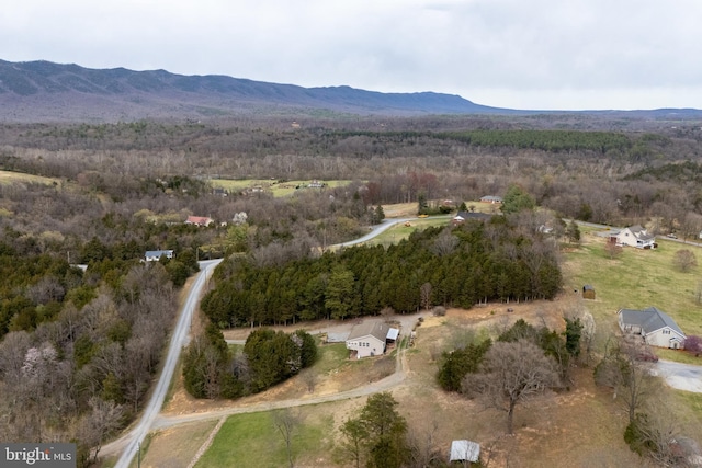 bird's eye view with a forest view and a mountain view