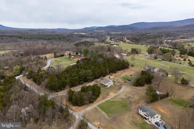 birds eye view of property featuring a mountain view and a rural view