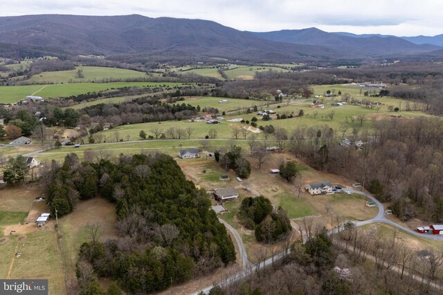 drone / aerial view featuring a mountain view and a rural view