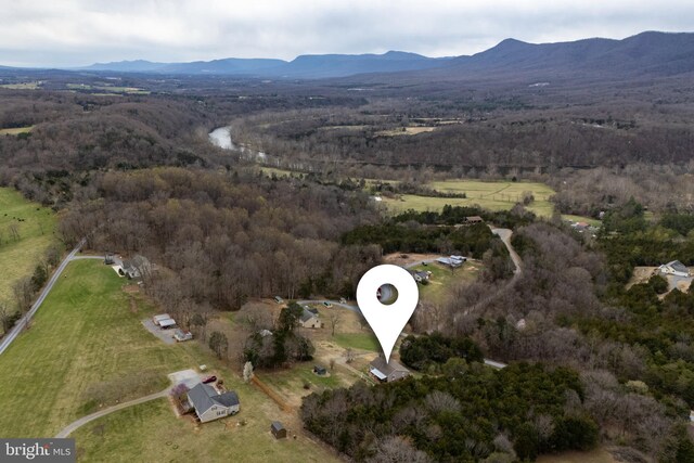 bird's eye view with a mountain view and a forest view