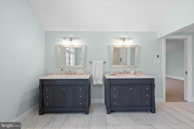 bathroom featuring baseboards and a sink