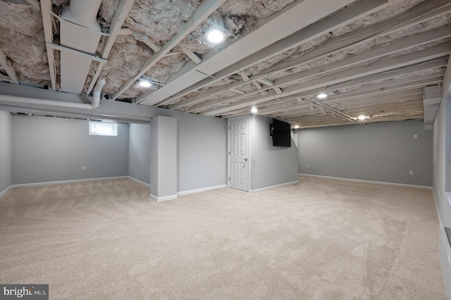 basement with baseboards and carpet floors