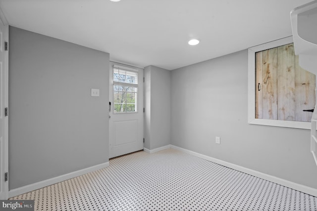 empty room with recessed lighting and baseboards