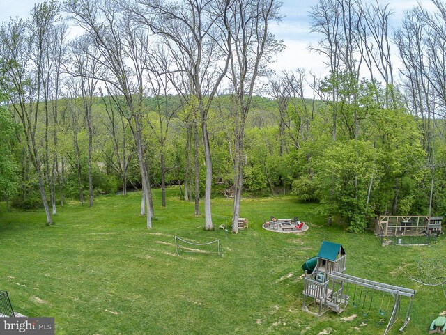 view of yard featuring a view of trees