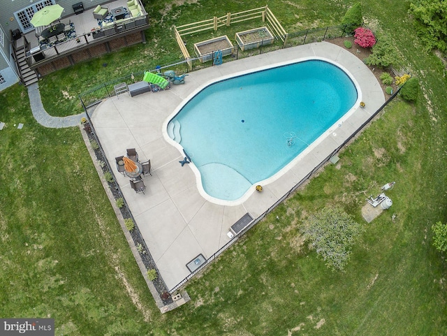 view of swimming pool featuring fence and a fenced in pool