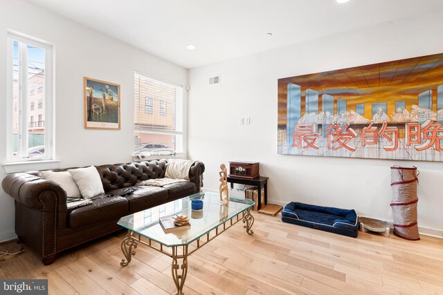 1649 N Randolph St, Philadelphia, PA 19122 - living area with wood finished floors, healthy amount of natural light, recessed lighting, and baseboards