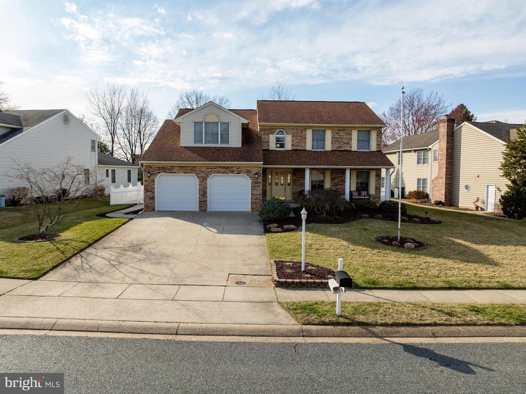 1922 Munsey Dr, Forest Hill, MD 21050 - traditional home with brick siding, a front lawn, fence, and driveway