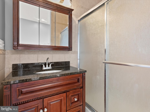 1614 Patapsco St, Baltimore, MD 21230 - full bath with vanity, a shower with shower door, and decorative backsplash