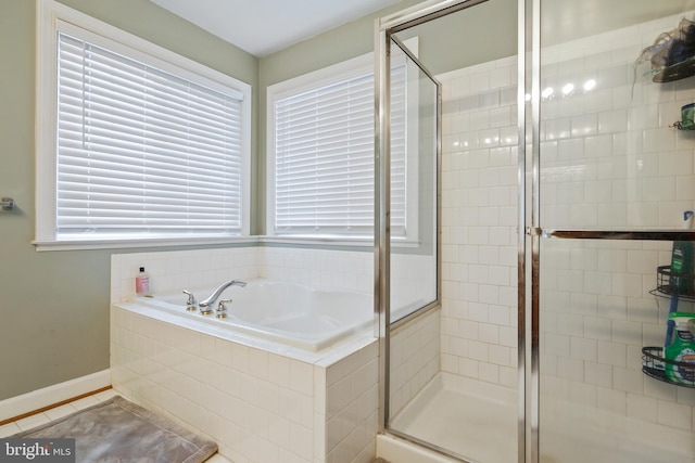 8509 Lexington Dr, Severn, MD 21144 - bathroom with baseboards, a garden tub, tile patterned flooring, and a shower stall