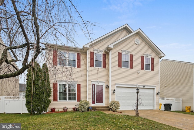 8509 Lexington Dr, Severn, MD 21144 - view of front of house featuring concrete driveway, a front lawn, fence, and an attached garage