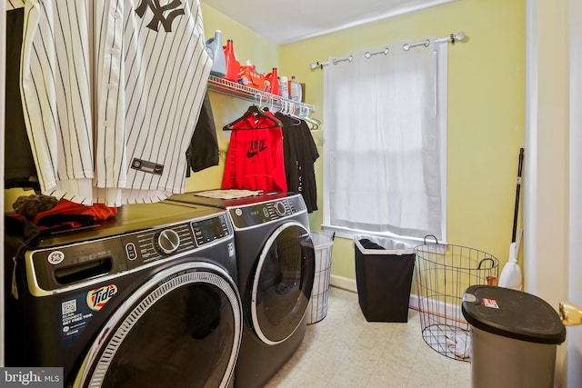 8509 Lexington Dr, Severn, MD 21144 - laundry room with baseboards, independent washer and dryer, and laundry area