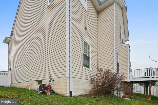 8509 Lexington Dr, Severn, MD 21144 - view of home's exterior with fence, a lawn, and a deck