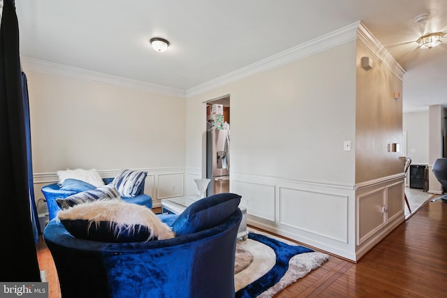 8509 Lexington Dr, Severn, MD 21144 - living area featuring wainscoting, crown molding, and wood finished floors