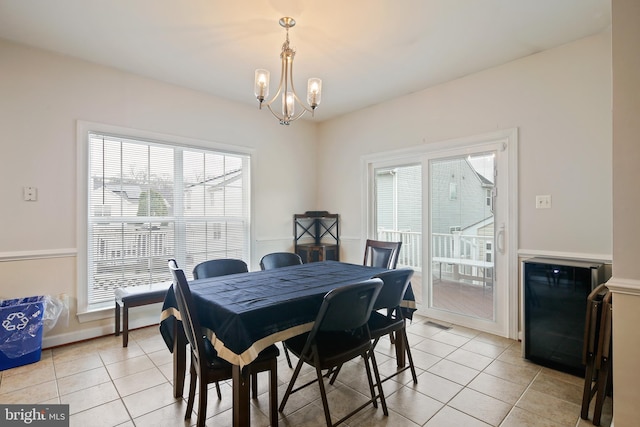 8509 Lexington Dr, Severn, MD 21144 - dining room with light tile patterned floors and a chandelier