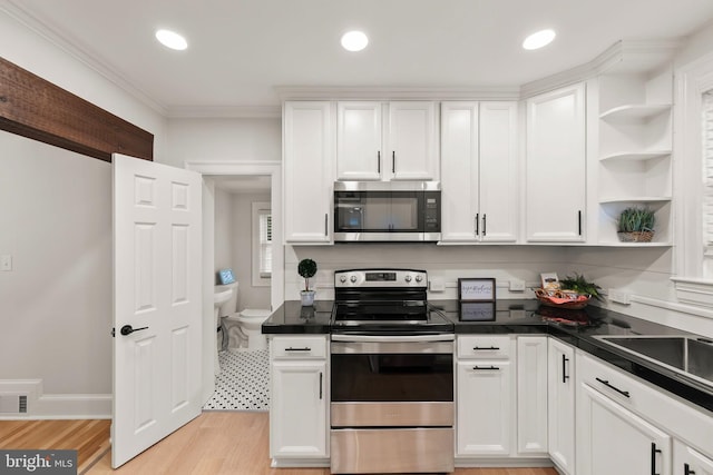 512 Dunlap St, Winchester, VA 22601 - kitchen with stainless steel appliances, open shelves, white cabinets, dark countertops, and recessed lighting