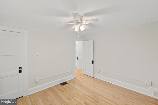 512 Dunlap St, Winchester, VA 22601 - empty room featuring light wood-style flooring, ornamental molding, a ceiling fan, and baseboards