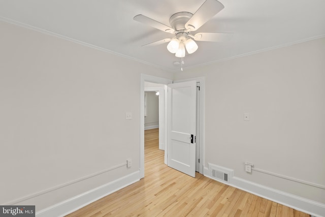 512 Dunlap St, Winchester, VA 22601 - empty room with a ceiling fan, wood finished floors, ornamental molding, and baseboards