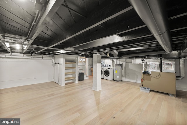 512 Dunlap St, Winchester, VA 22601 - finished below grade area featuring independent washer and dryer, water heater, wood finished floors, stairs, and heating unit