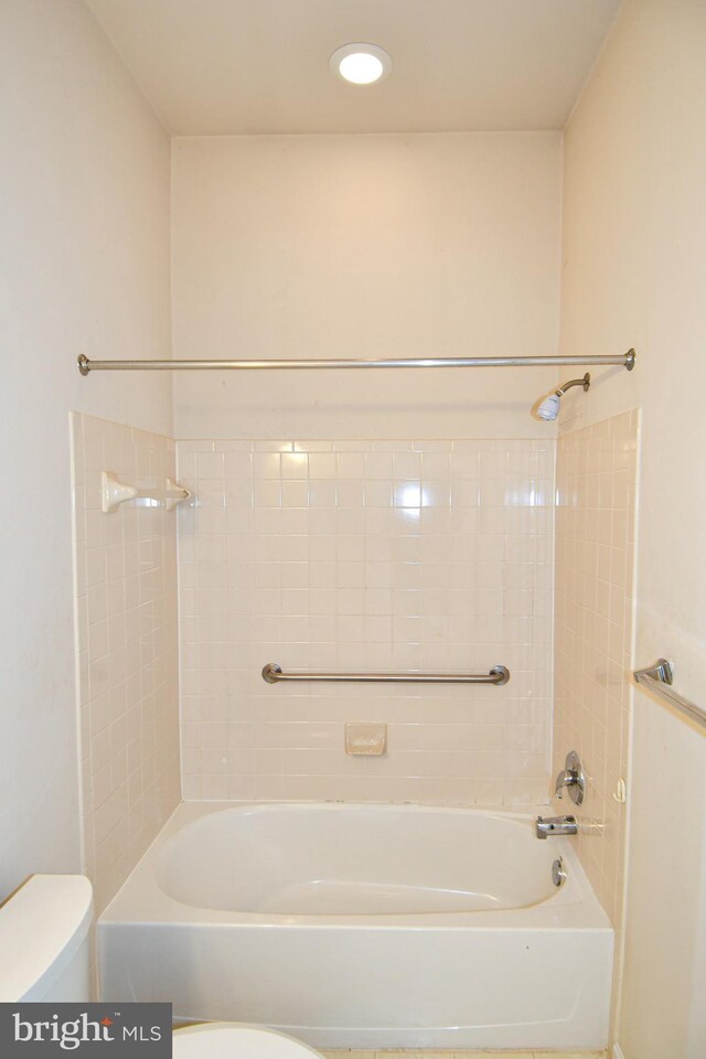 full bath featuring toilet and  shower combination