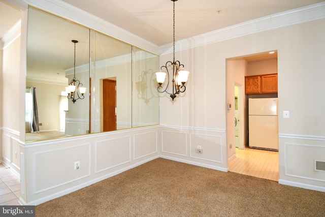 unfurnished dining area with a notable chandelier, light carpet, crown molding, visible vents, and a decorative wall